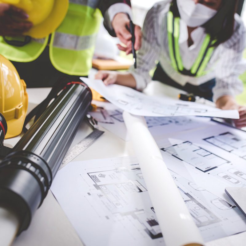 architect concept, working architect with blueprints in office to present to customers engineering concept
